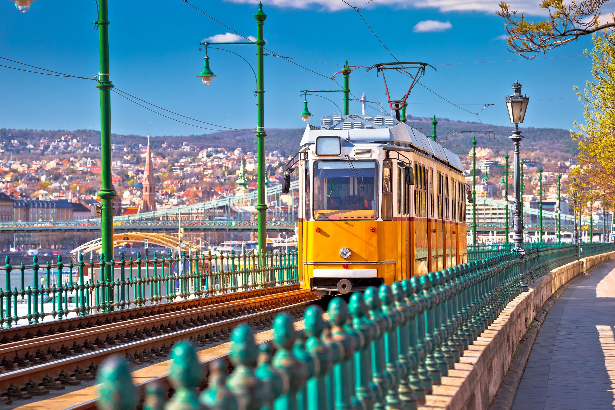 A view of a yellow tram in Budapest, Hungary