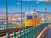 A view of a yellow tram in Budapest, Hungary