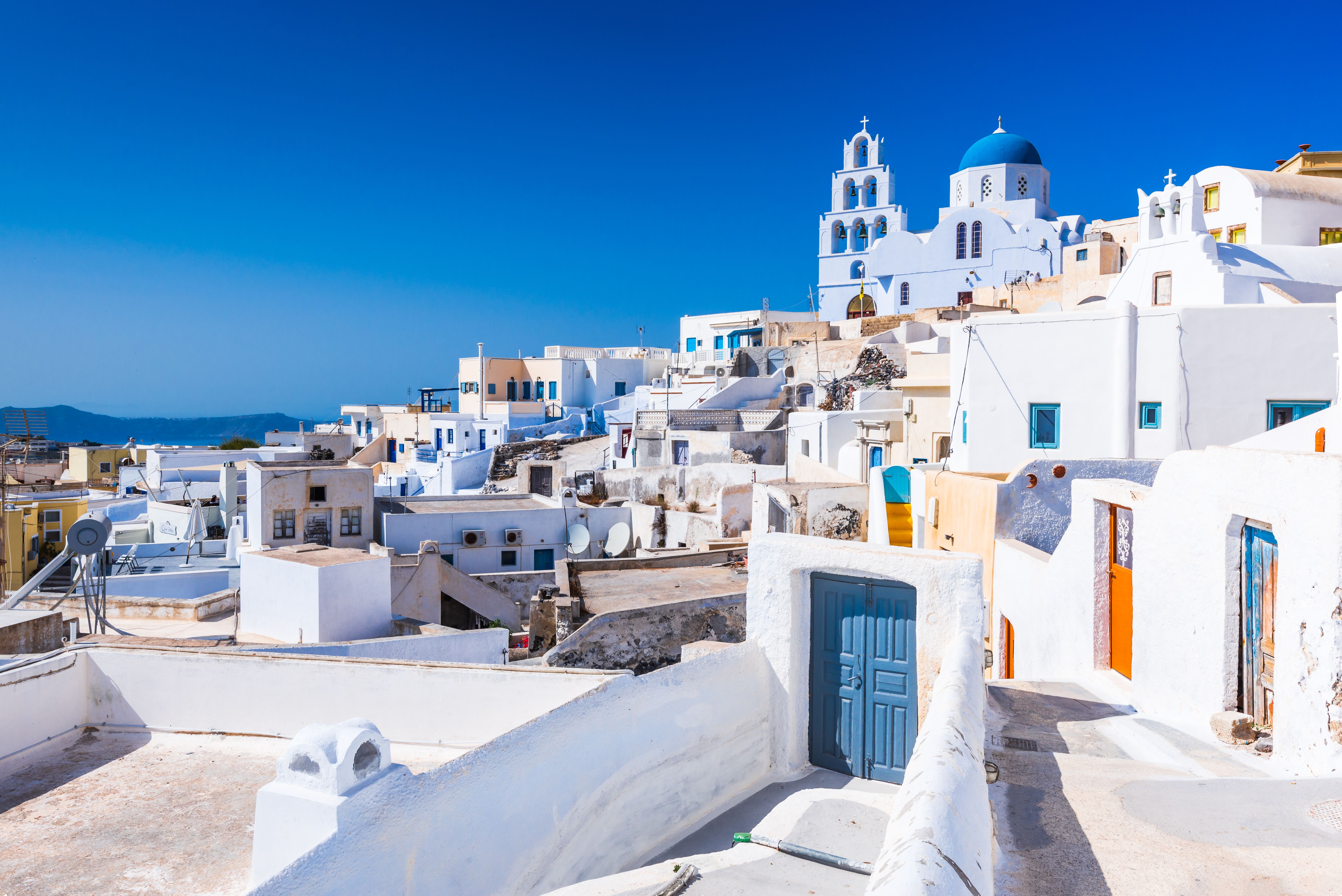 View of the whitewashed buildings and church of the hilltop town of Pyrgos