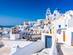 View of the whitewashed buildings and church of the hilltop town of Pyrgos