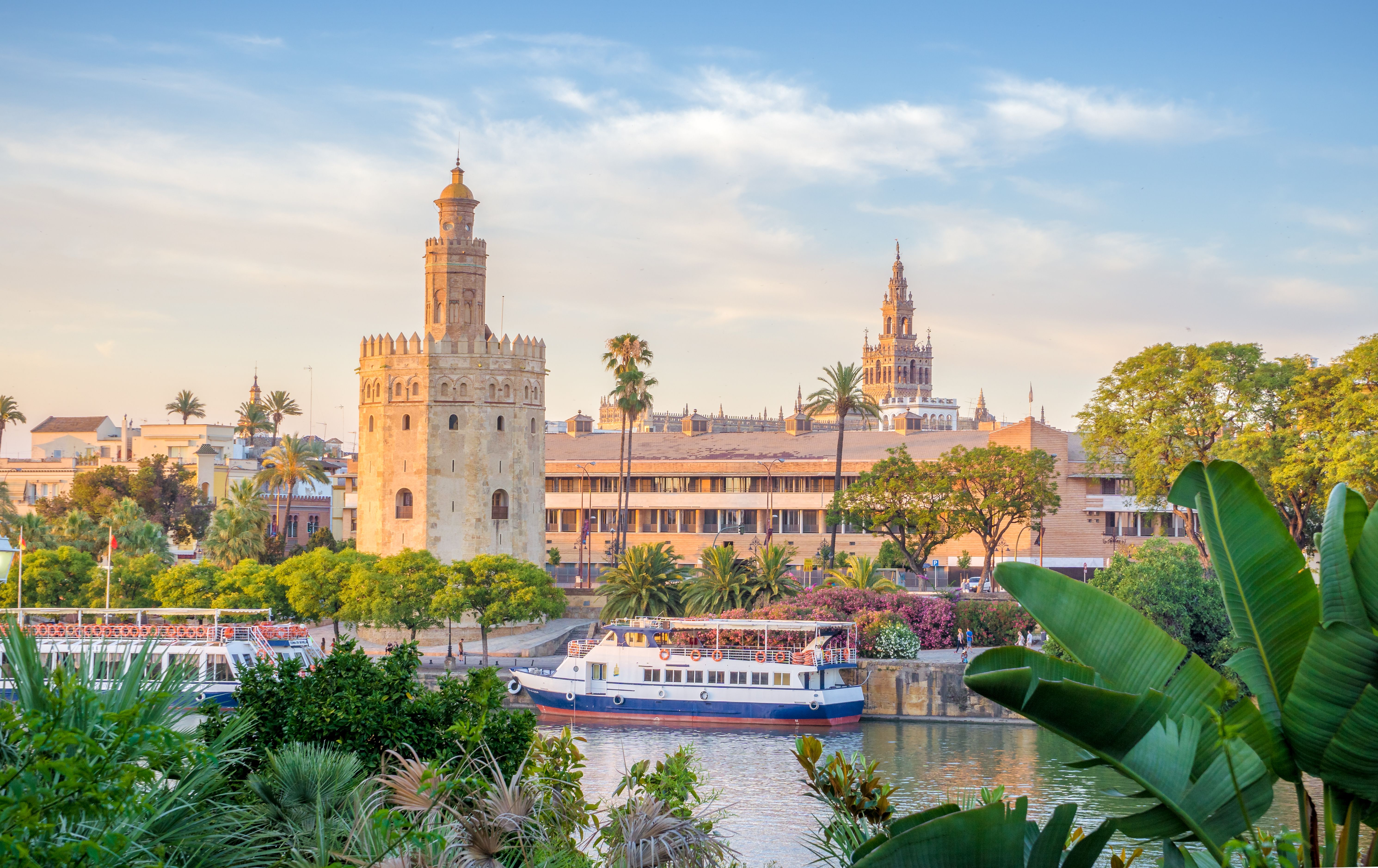Sunset view of Seville's Golden Tower on the banks of the Guadalquivir River