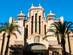 View of the sandstone, art deco facade of a food and produce market in Alicante.