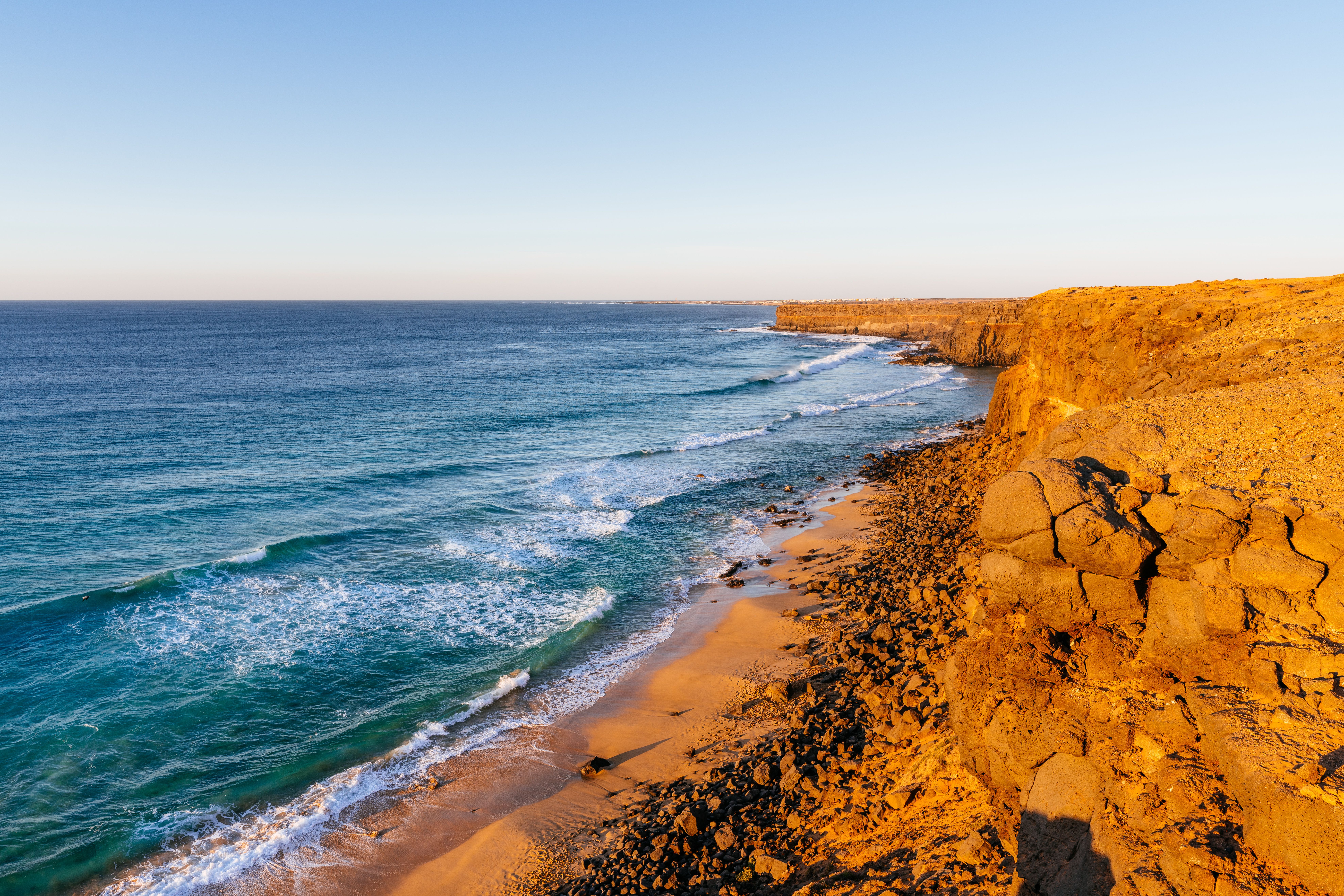 View of the wild Playa del Aguila at sunset