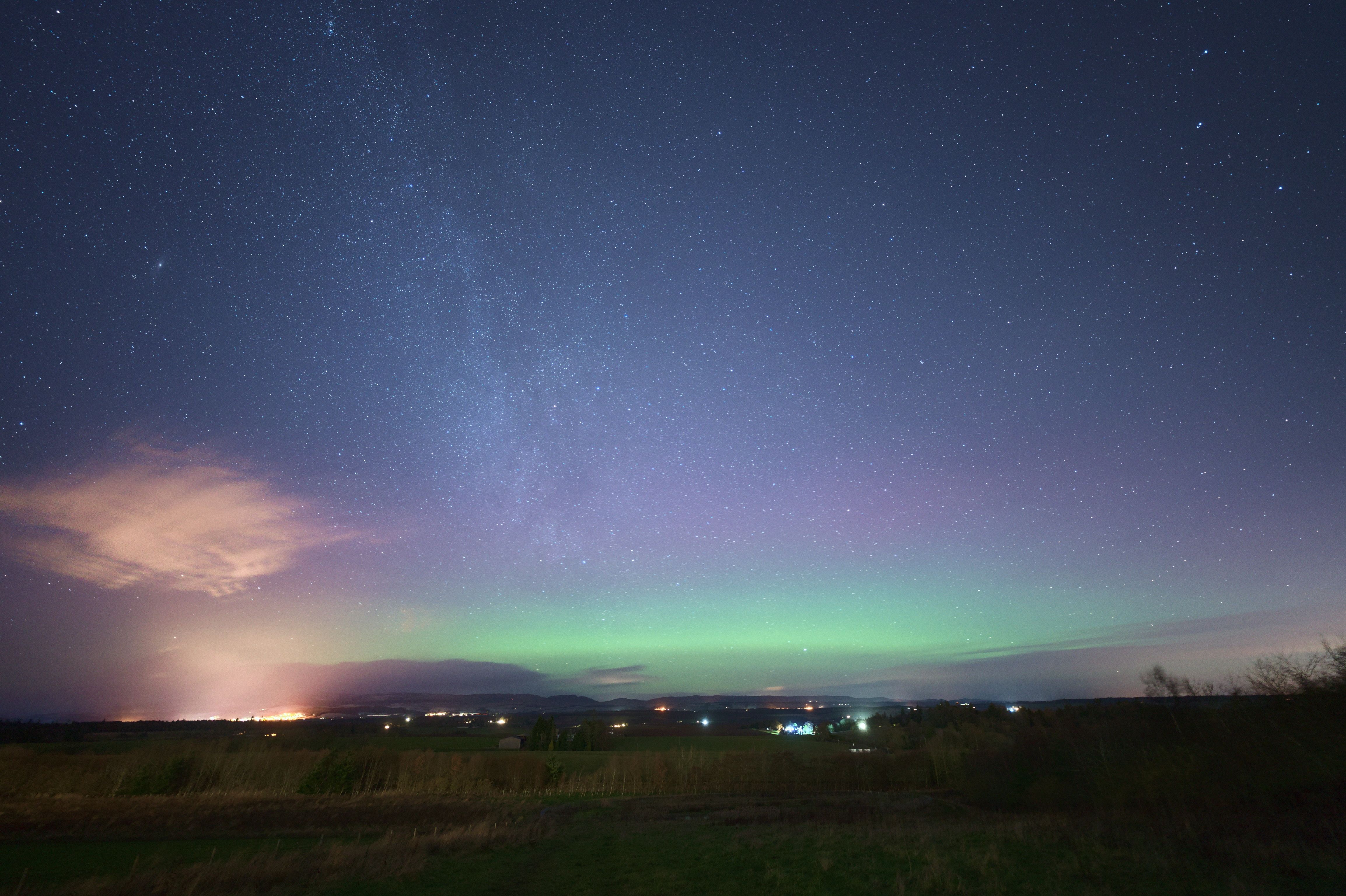 A view of the northern lights at dusk over Strathearn in Scotland