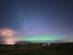 A view of the northern lights at dusk over Strathearn in Scotland