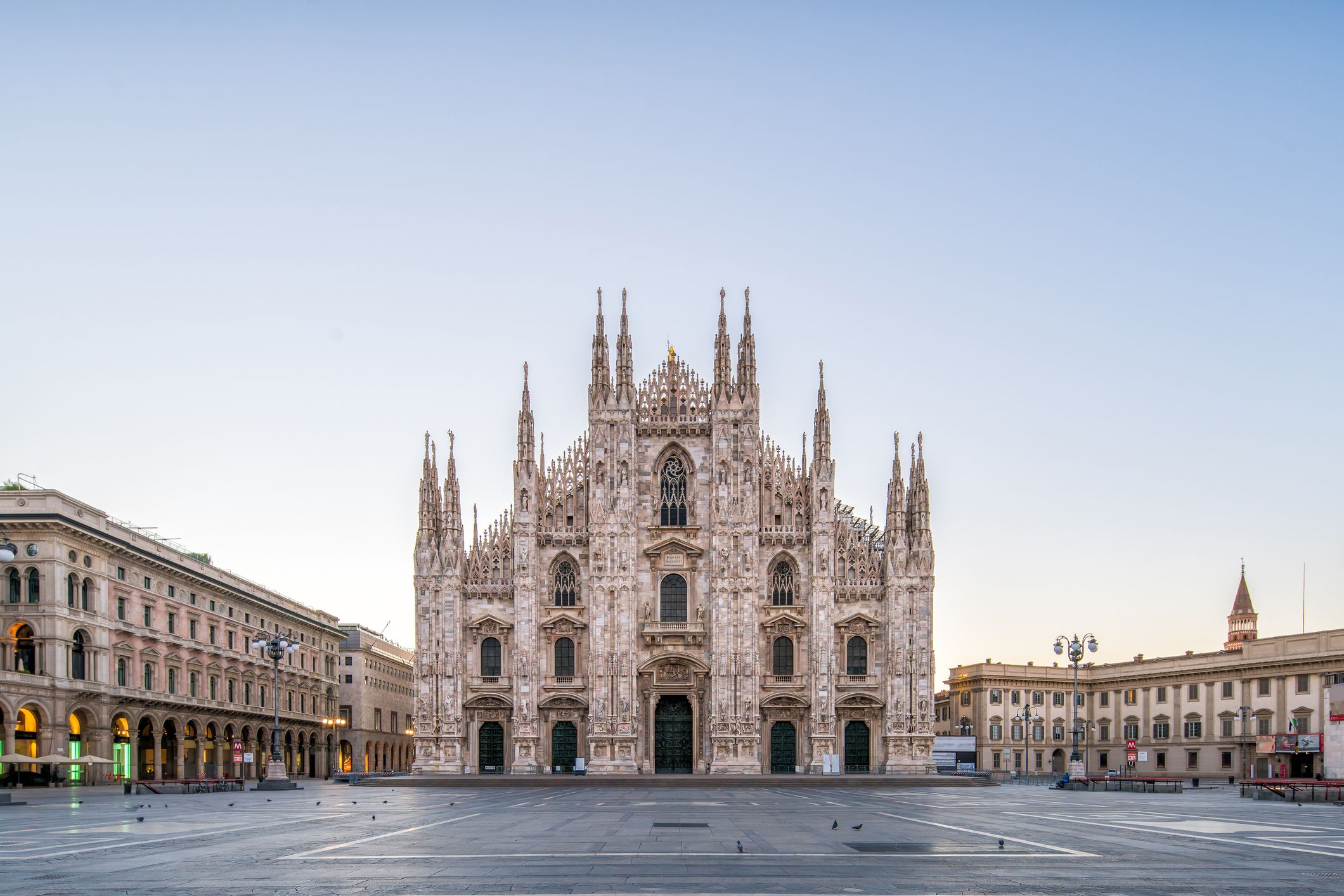 An empty Piazza del Duomo with the magestic Milan Cathedral at dawn