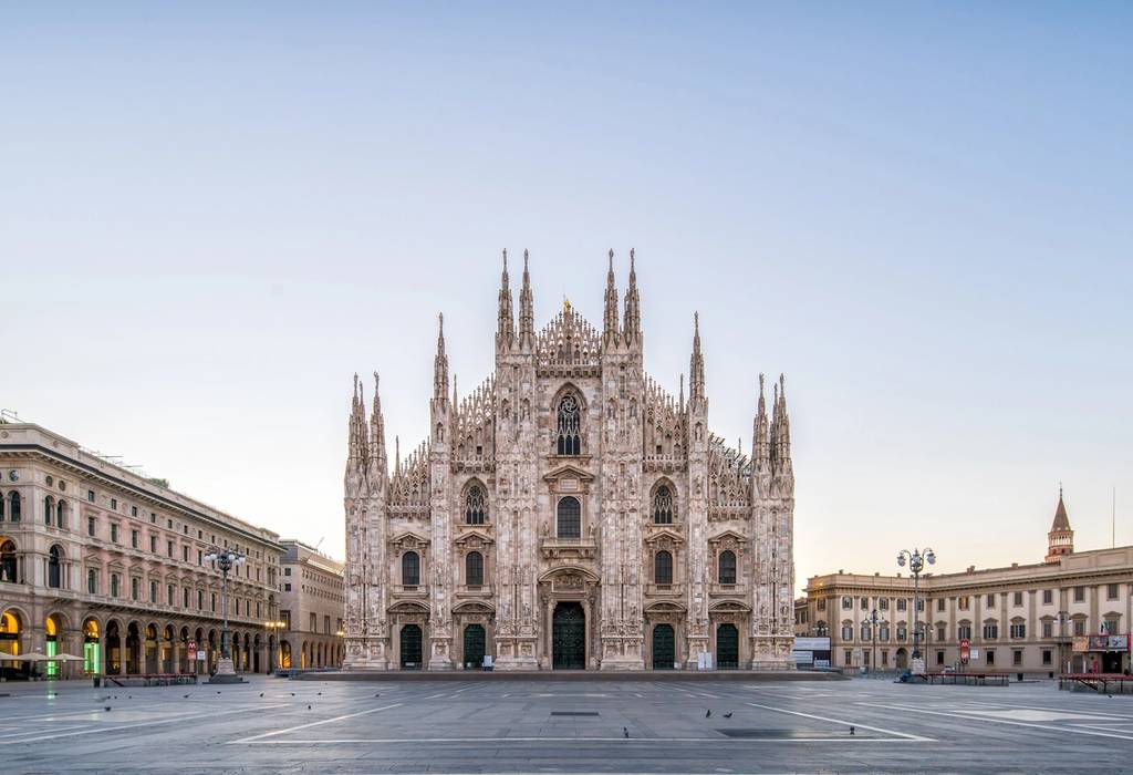 An empty Piazza del Duomo with the magestic Milan Cathedral at dawn