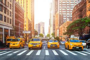 A line of yellow taxis at a road junction in New York