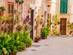 A traditional street in Valldemossa with colourful flowerpots, Majorca