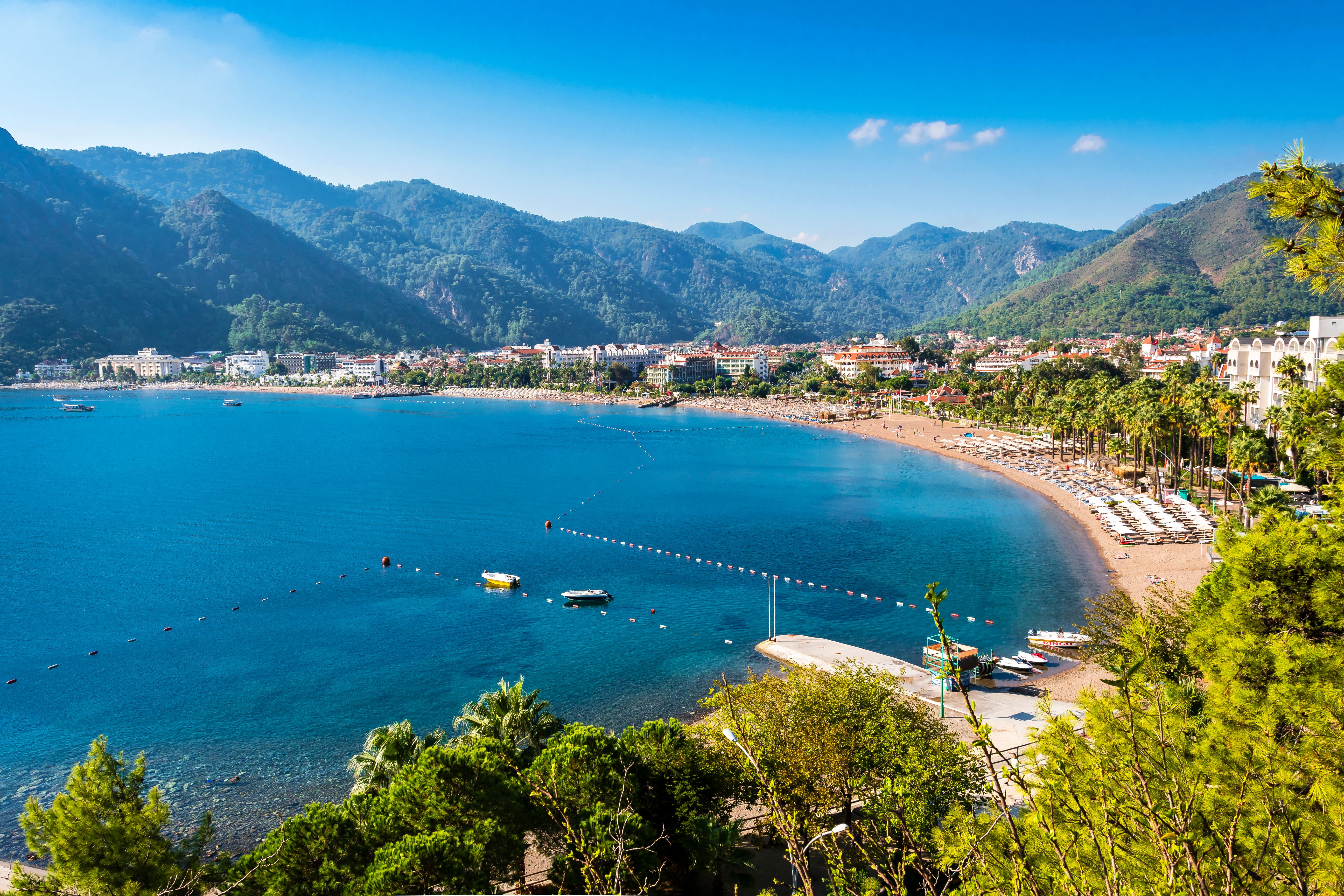 A view of Icmeler Beach and bay in Turkey on a bright summer day
