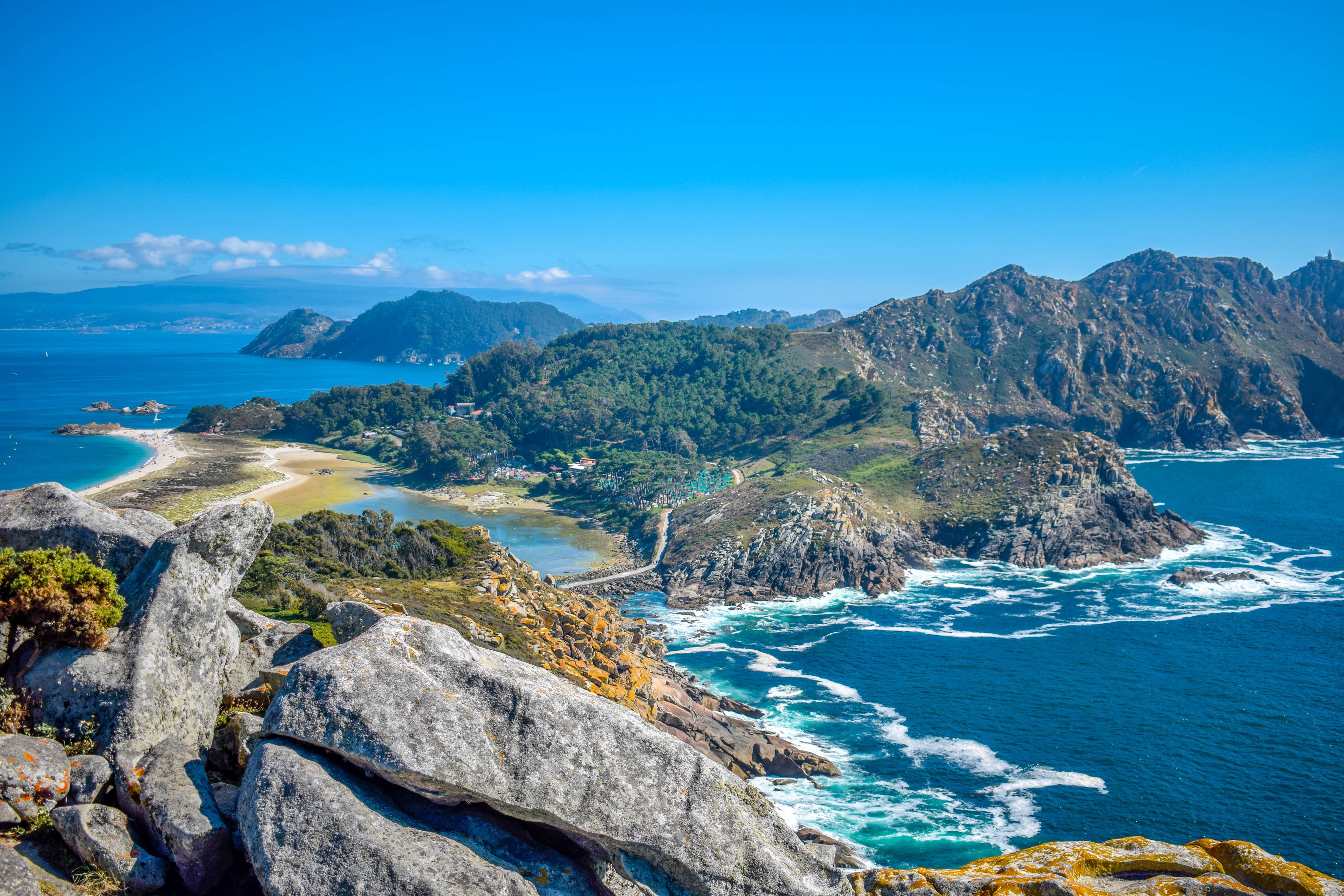 View of two rocky island connected by a white sand beach and a narrow road