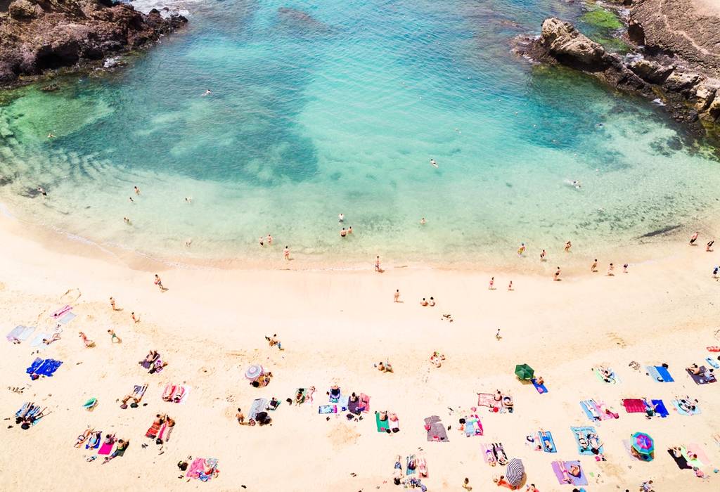 Aerial view of people at Papagayo beach in Lanzarote
