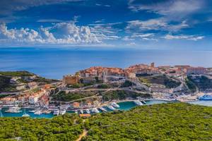 Aerial view of the City Bonifacio located on the steep cliffs above the Mediterranean sea in Corsica. Corse-du-Sud, France