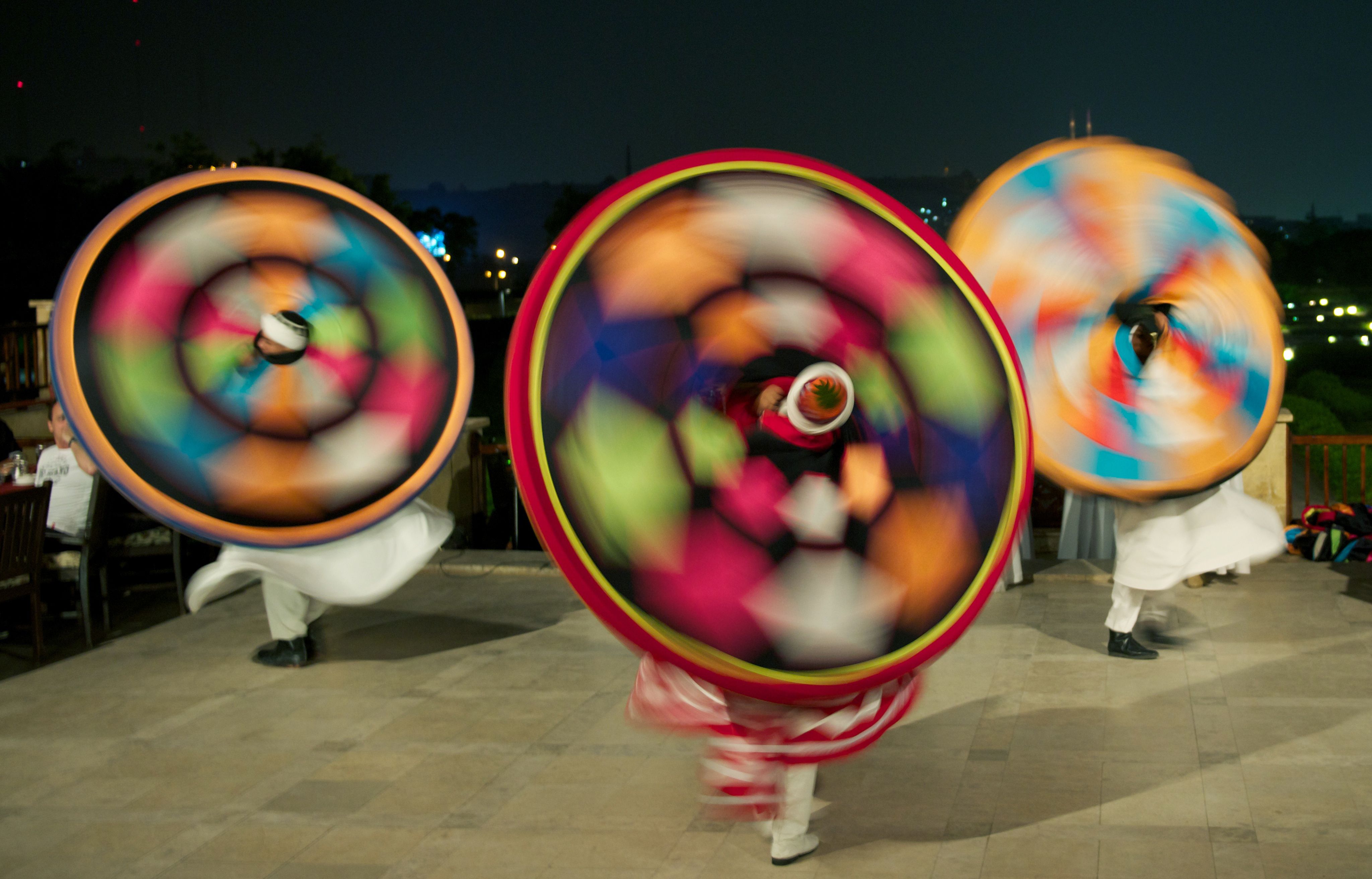 An action shot of Darvish dancers - a traditional Egyptian dance known as Tanoura.