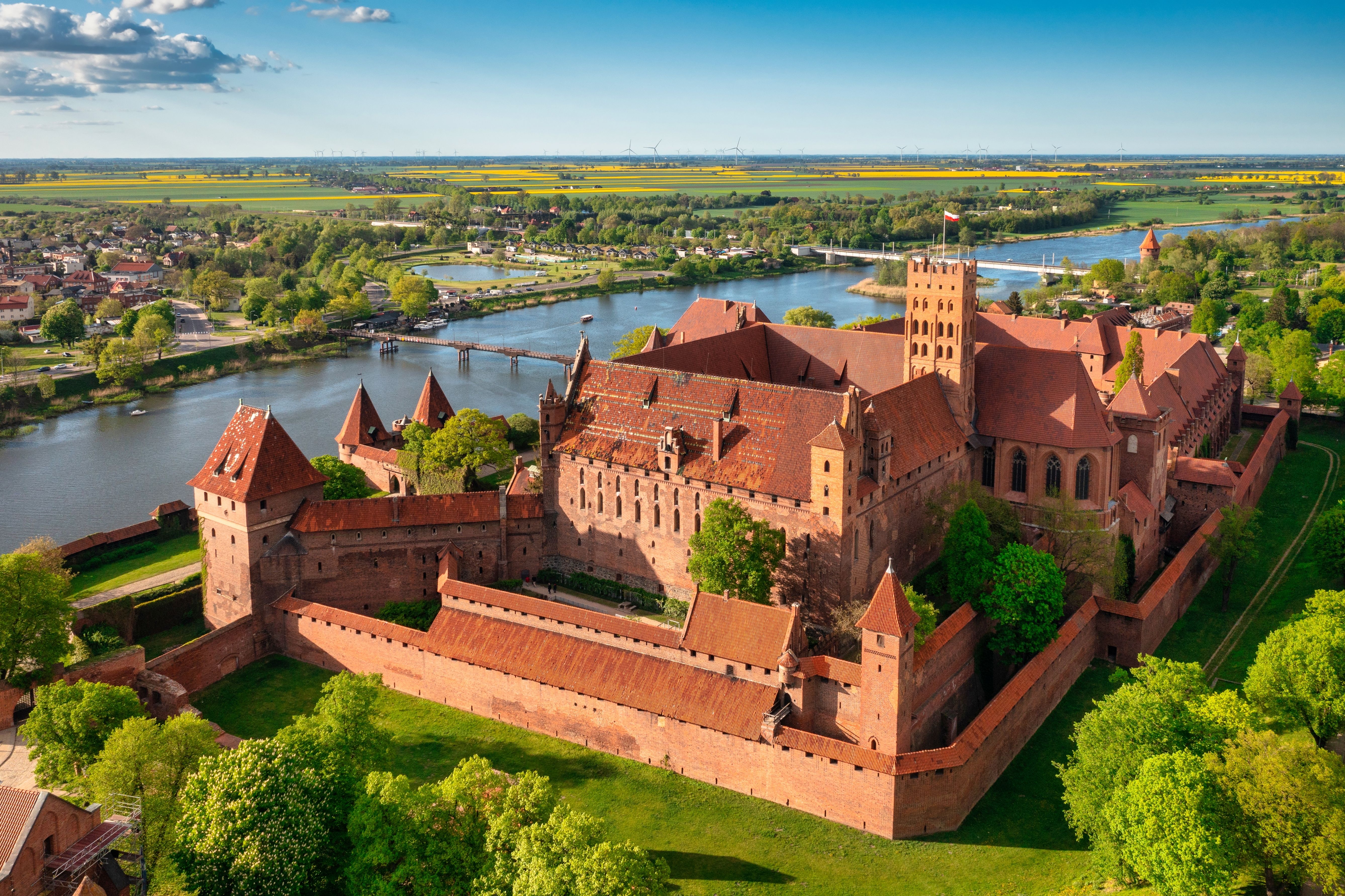 An aerial view of the Castle of the Teutonic Order in Malbork by the Nogat river in Poland