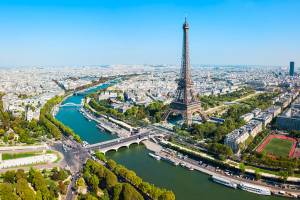 Aerial view of the Eiffel Tower, the River Seine and the cityscape of Paris on a sunny day