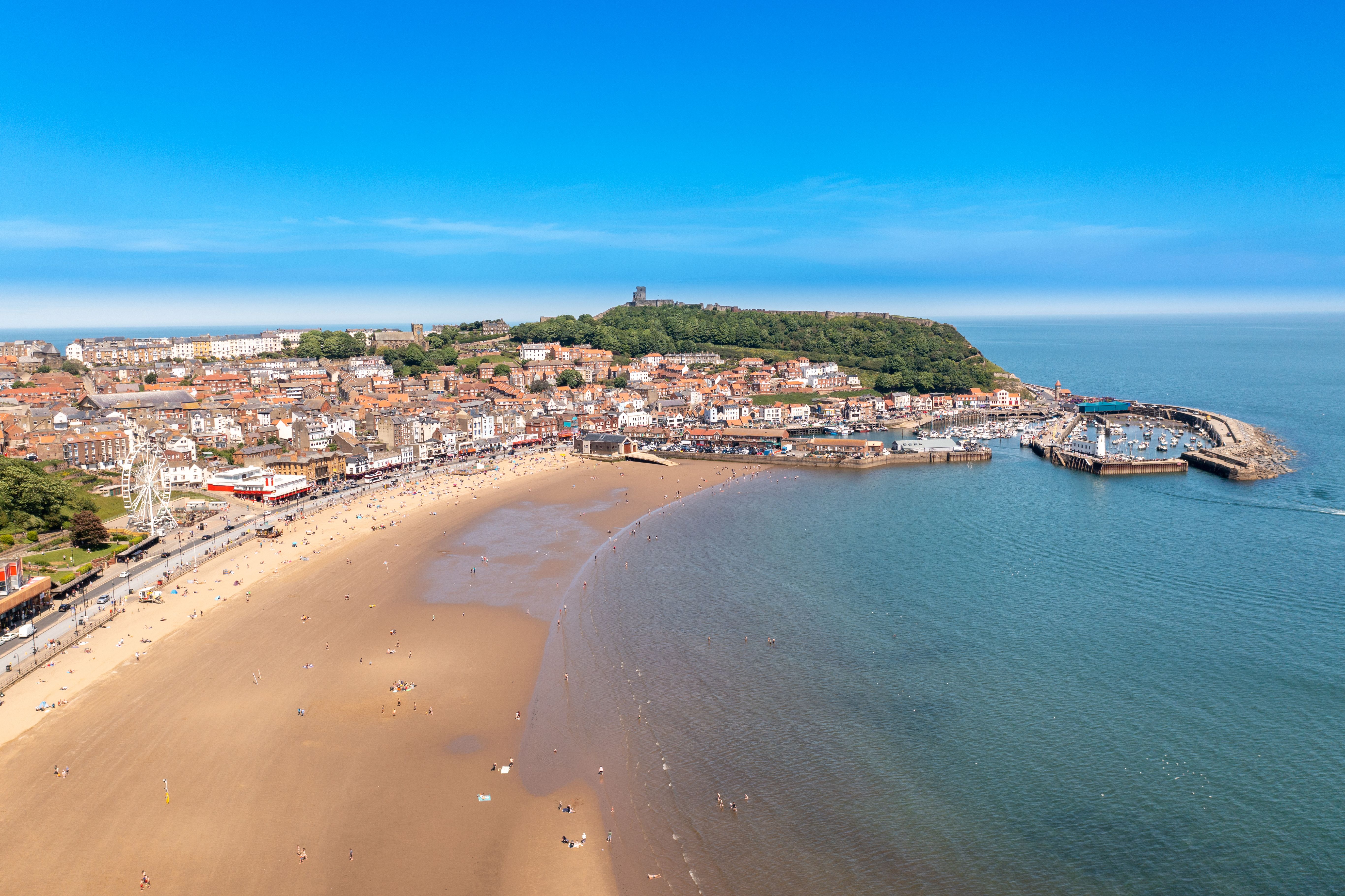 An aerial view of Scarborough beach and town in the UK