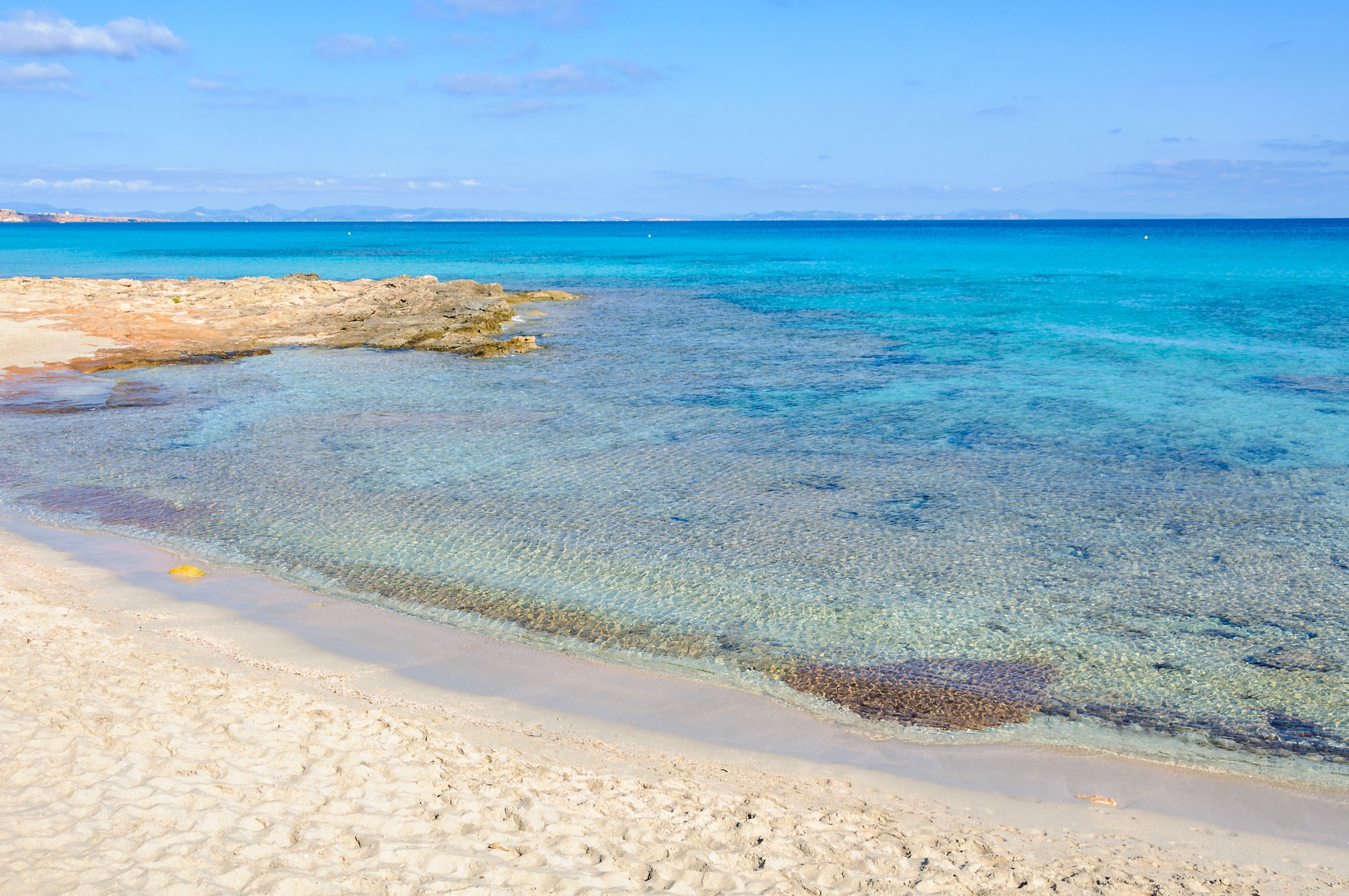 Close up of the white-sand beach of Ses Platgetes in Formentera