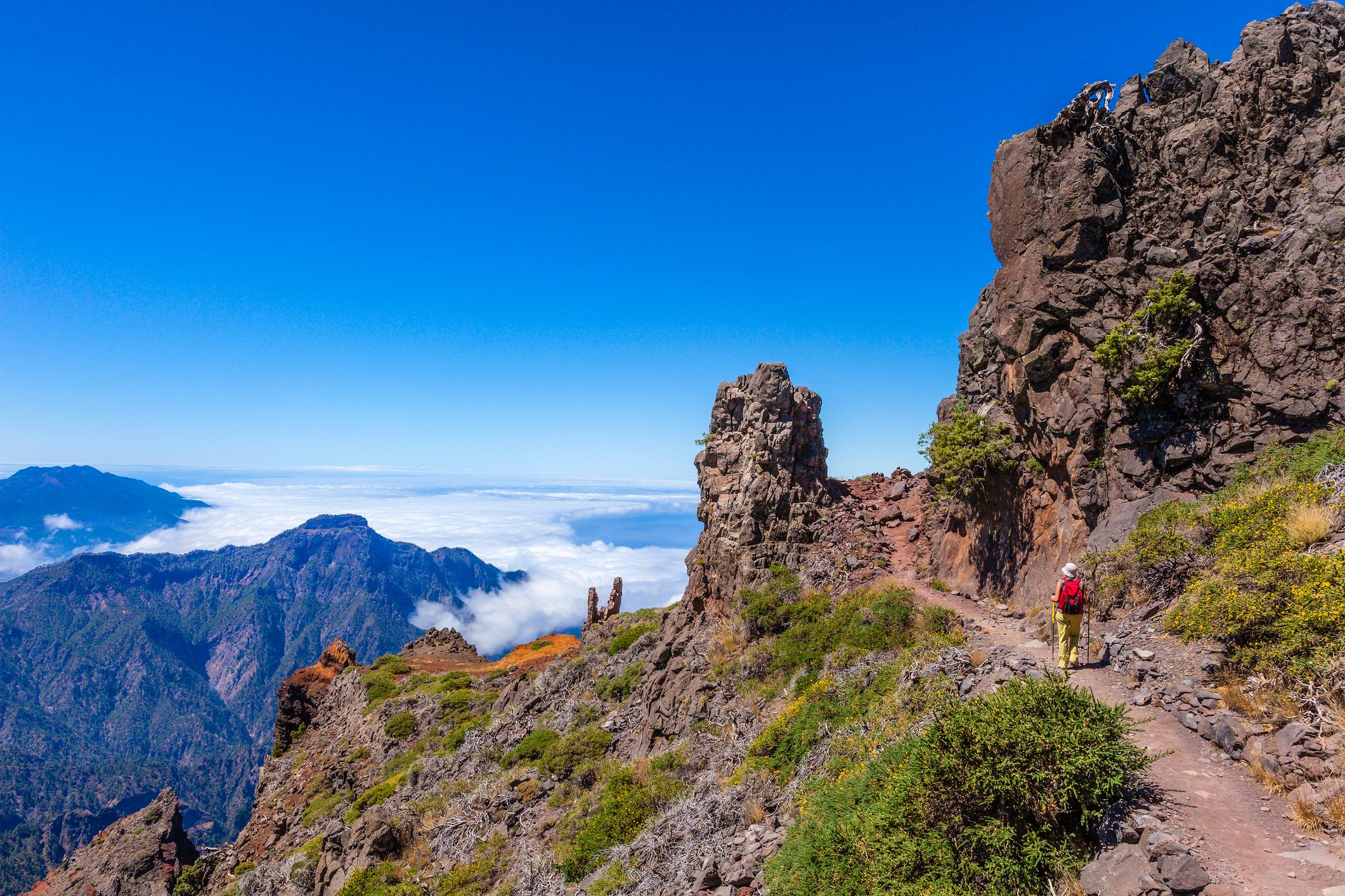 Woman walking on a mountain footpath in the Caldera de Taburiente National Park in La Palma, Canary Islands
