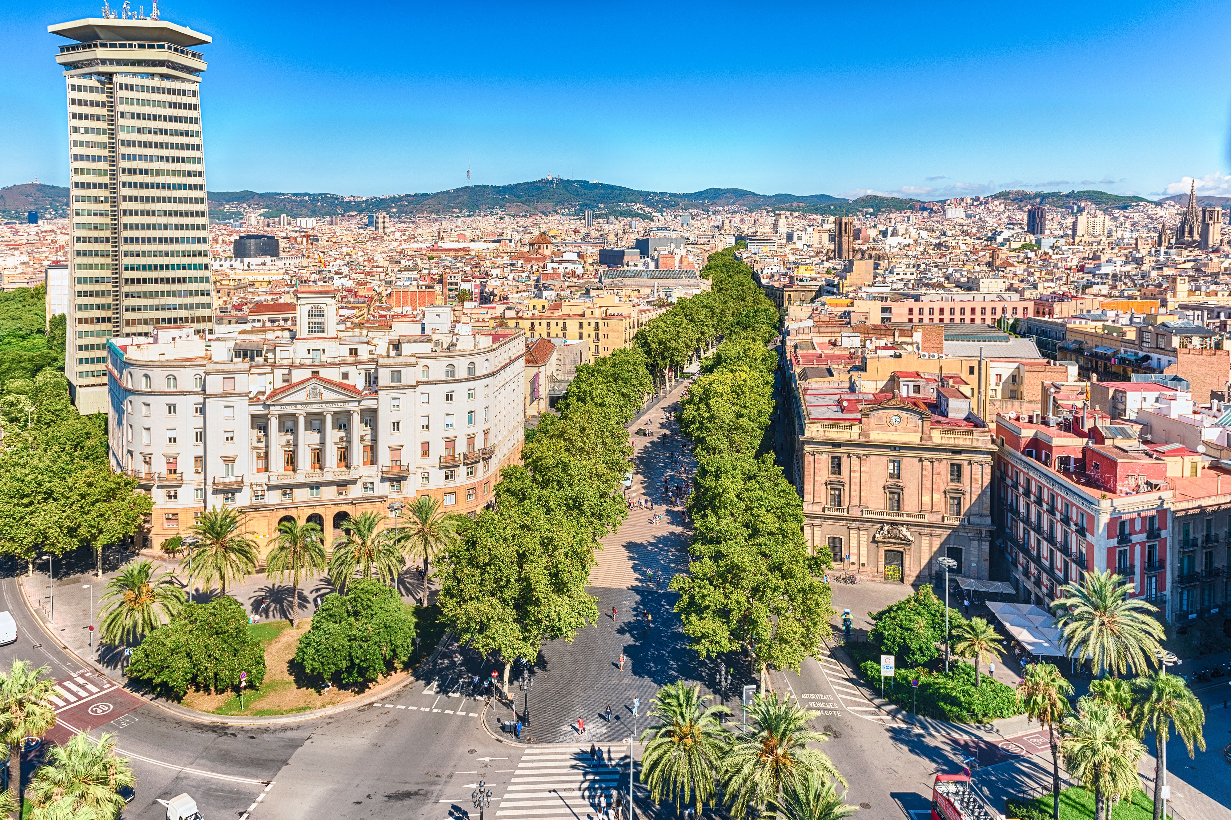 A view of La Rambla in Barcelona on a bright blue day