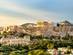 A sunset lights the Parthenon in on top of the Acropolis Hill in Athens