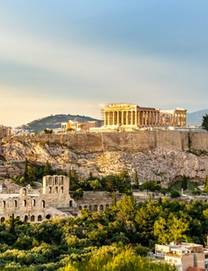 A sunset lights the Parthenon in on top of the Acropolis Hill in Athens