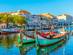 Moliceiro boats mooring alongside the central canal in Aveiro, Portugal