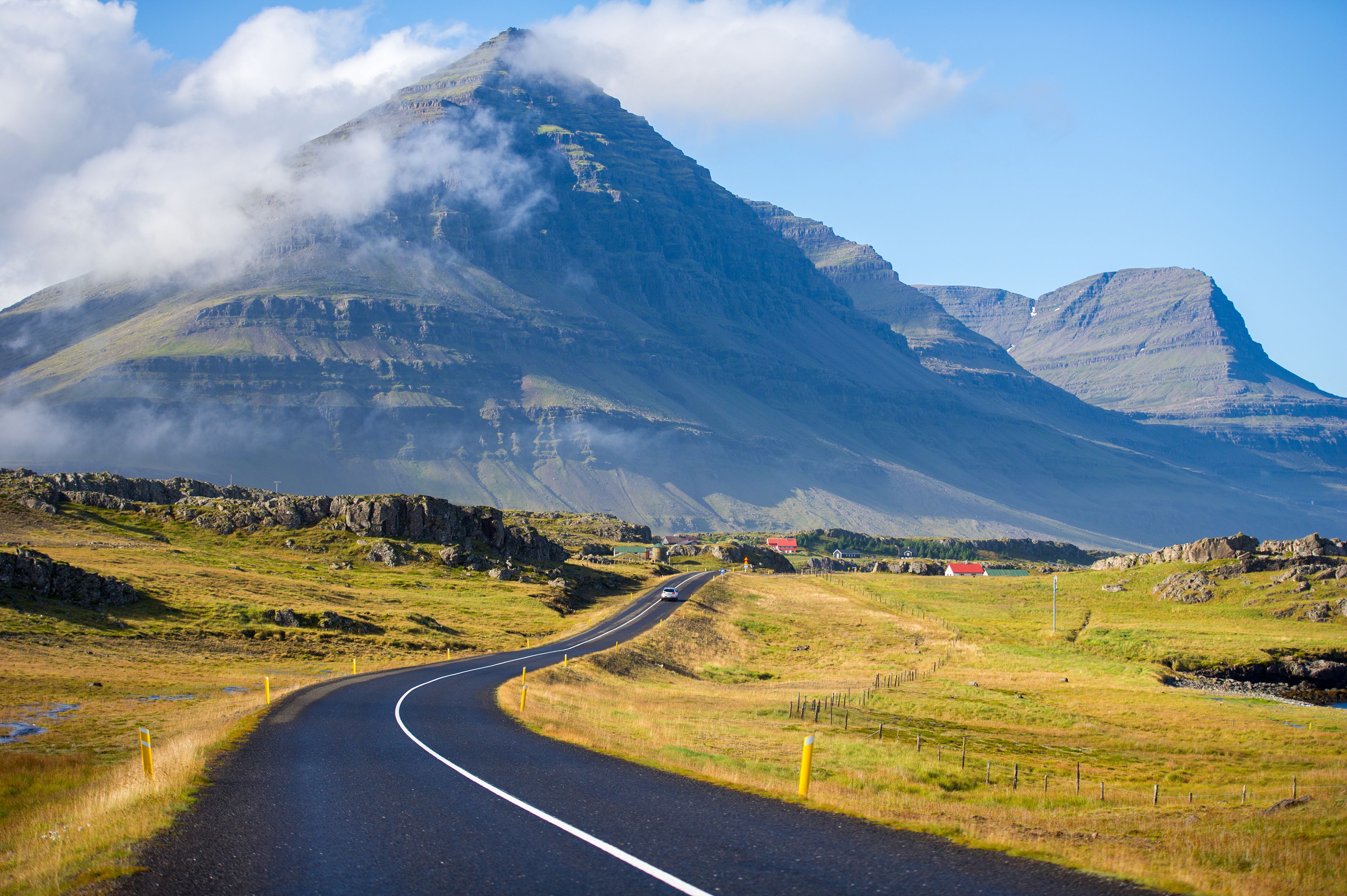 A road leading to mountains in Iceland