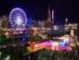 Christmas Market at Edinburgh, Scotland with lit up Big Wheel and festive lights