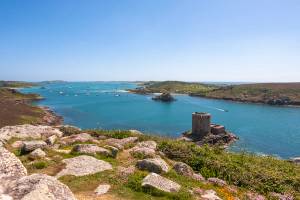 View looking out over the blue seas and islands of the Isles of Scilly