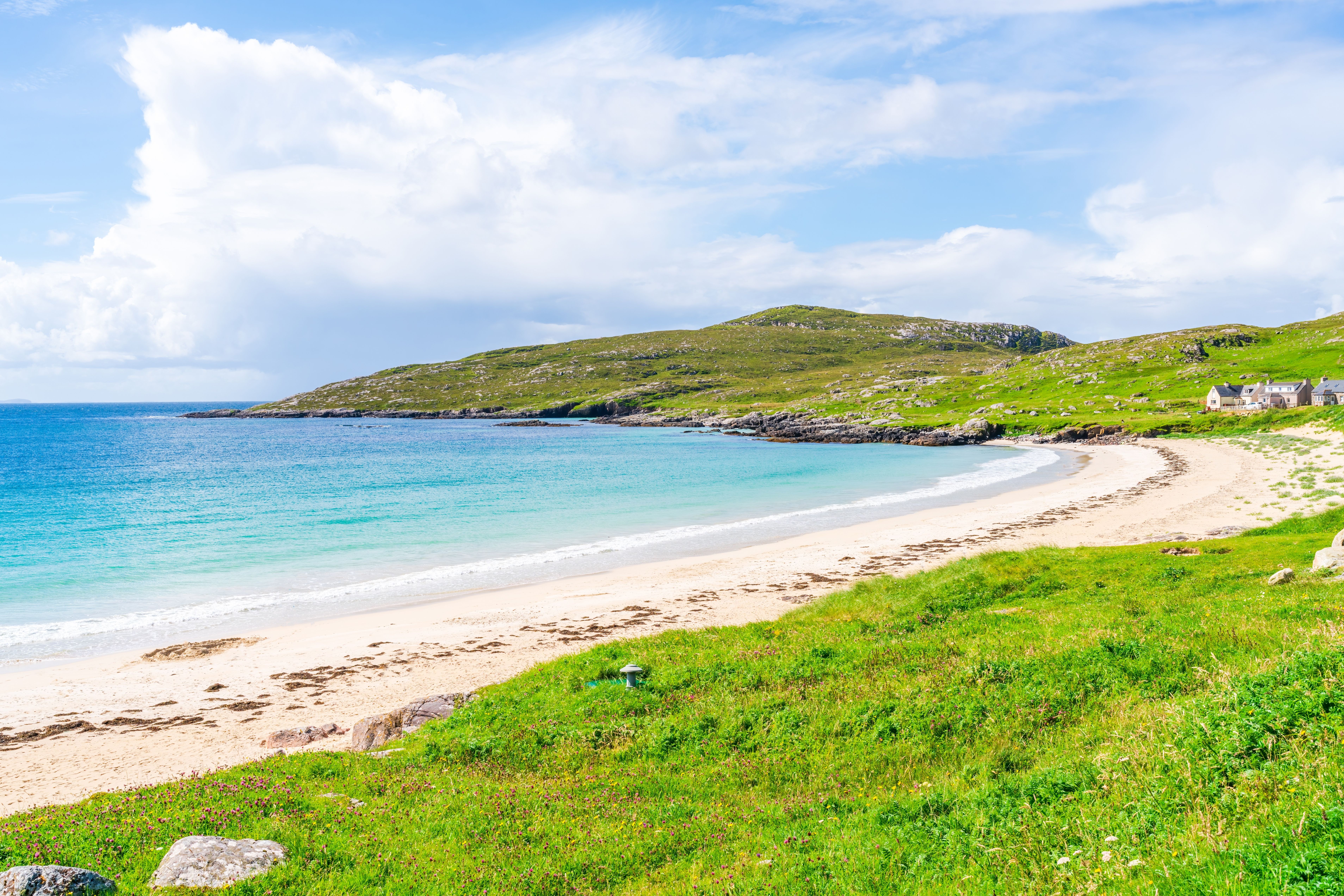 View of a Caribbean-esque beach with turquoise water and white sand
