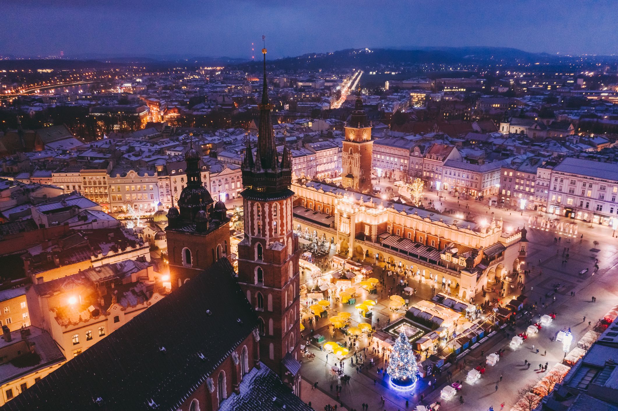 Aerial view of Krakow city centre at night decorated for Christmas with festive markets
