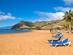 Sunny day on golden Las Teresitas beachw tih sun-loungers and parasols on the sand