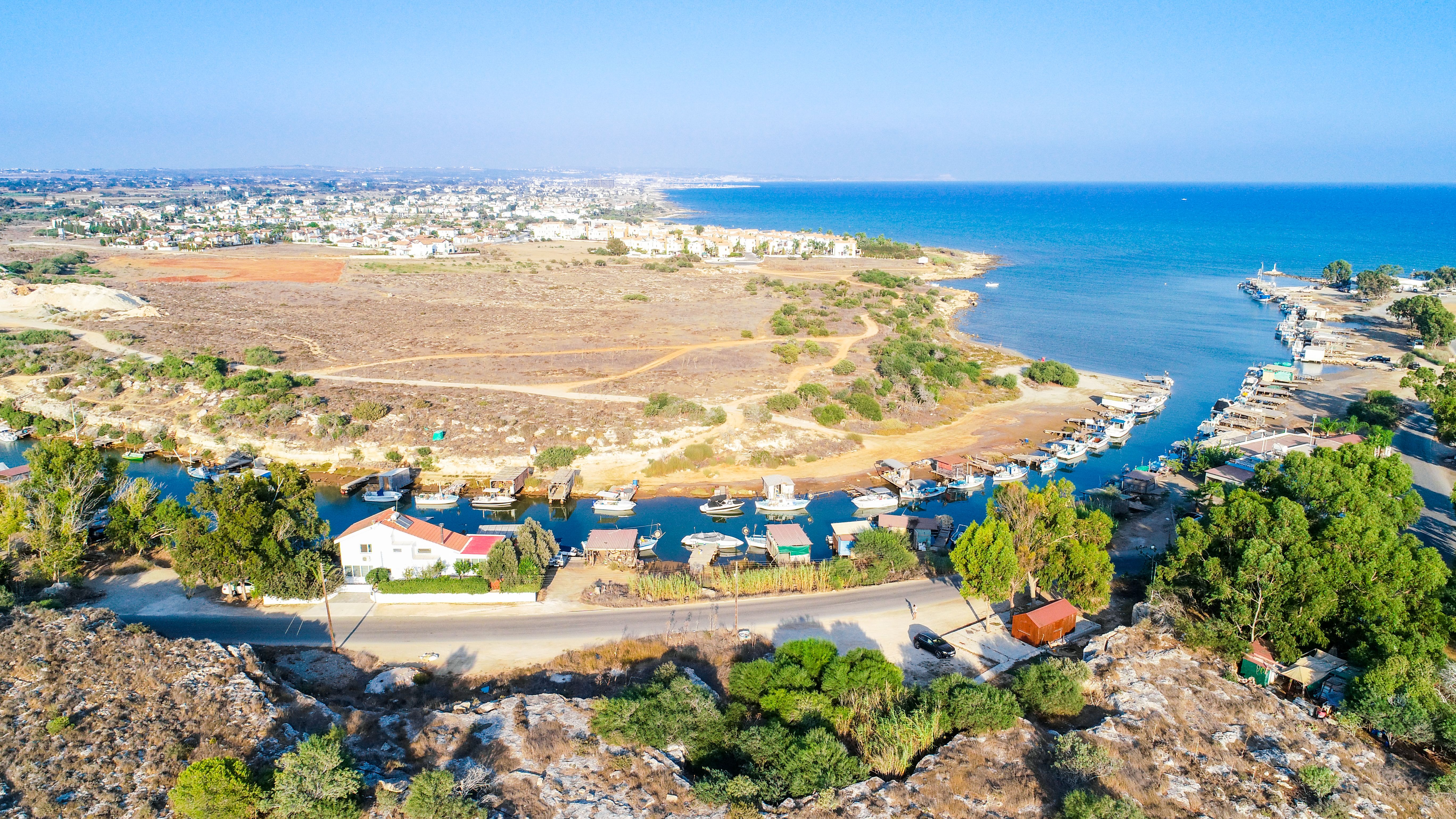 Aerial view of Liopetri river lined by fishing boats near Ayia Napa in Cyprus.