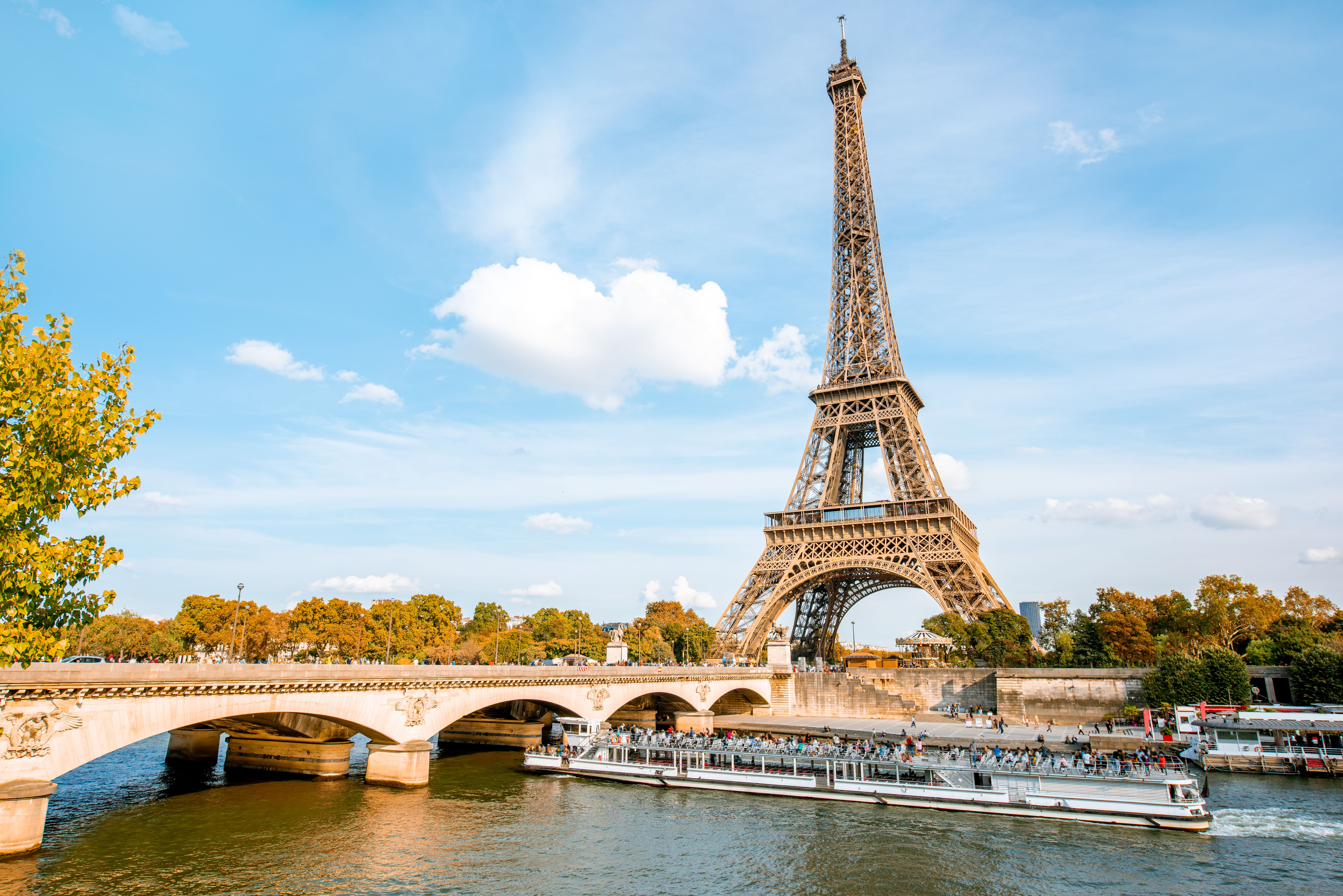 View on the Eiffel tower on Seine river during the autumn in Paris