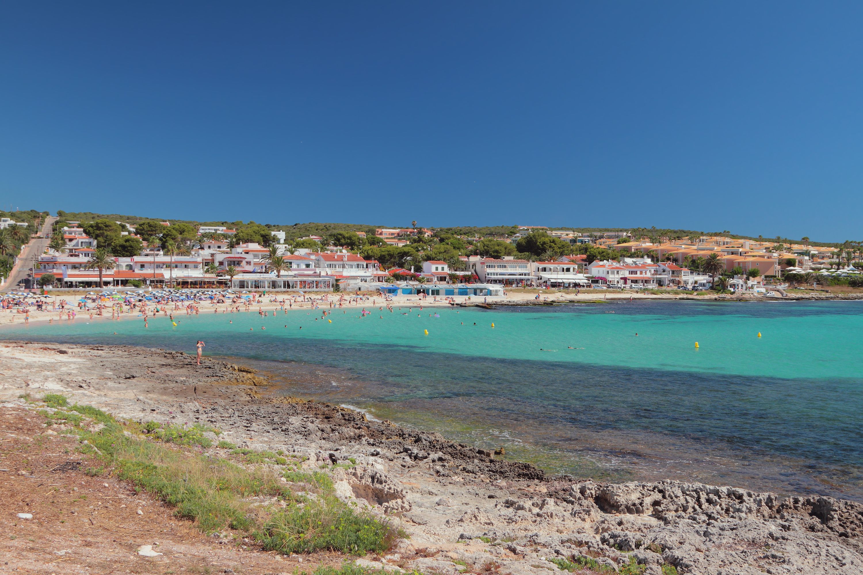 A view across the sea of Punta Prima resort in Menorca, Balearic Islands