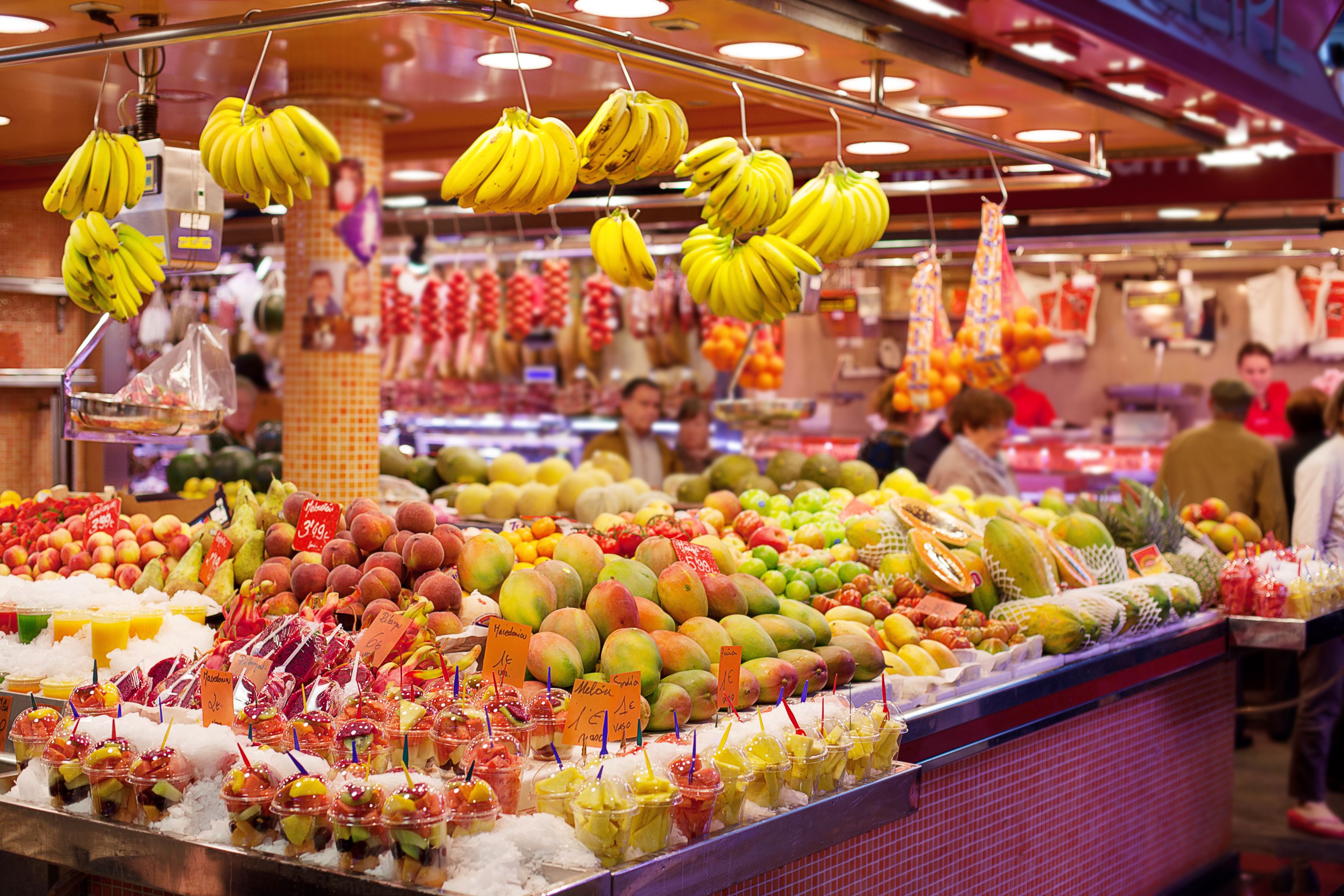 Colourful display of fresh fruit for sale at La Boqueria food markets in Barcelona, Spain