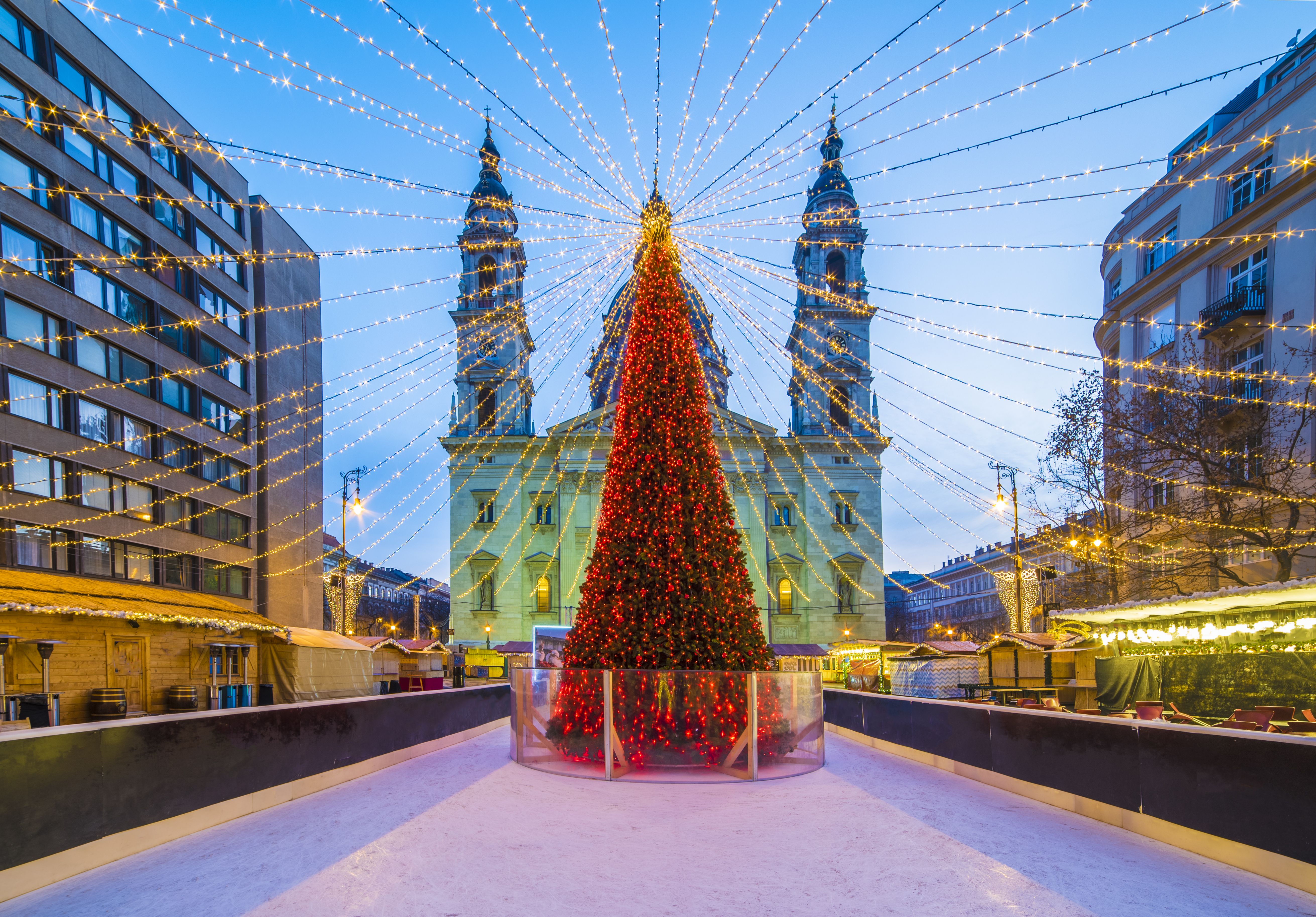 Red LED-light decorated Christmas tree at the Christmas Market in Saint Stephen Basilica square in Budapest, Hungary