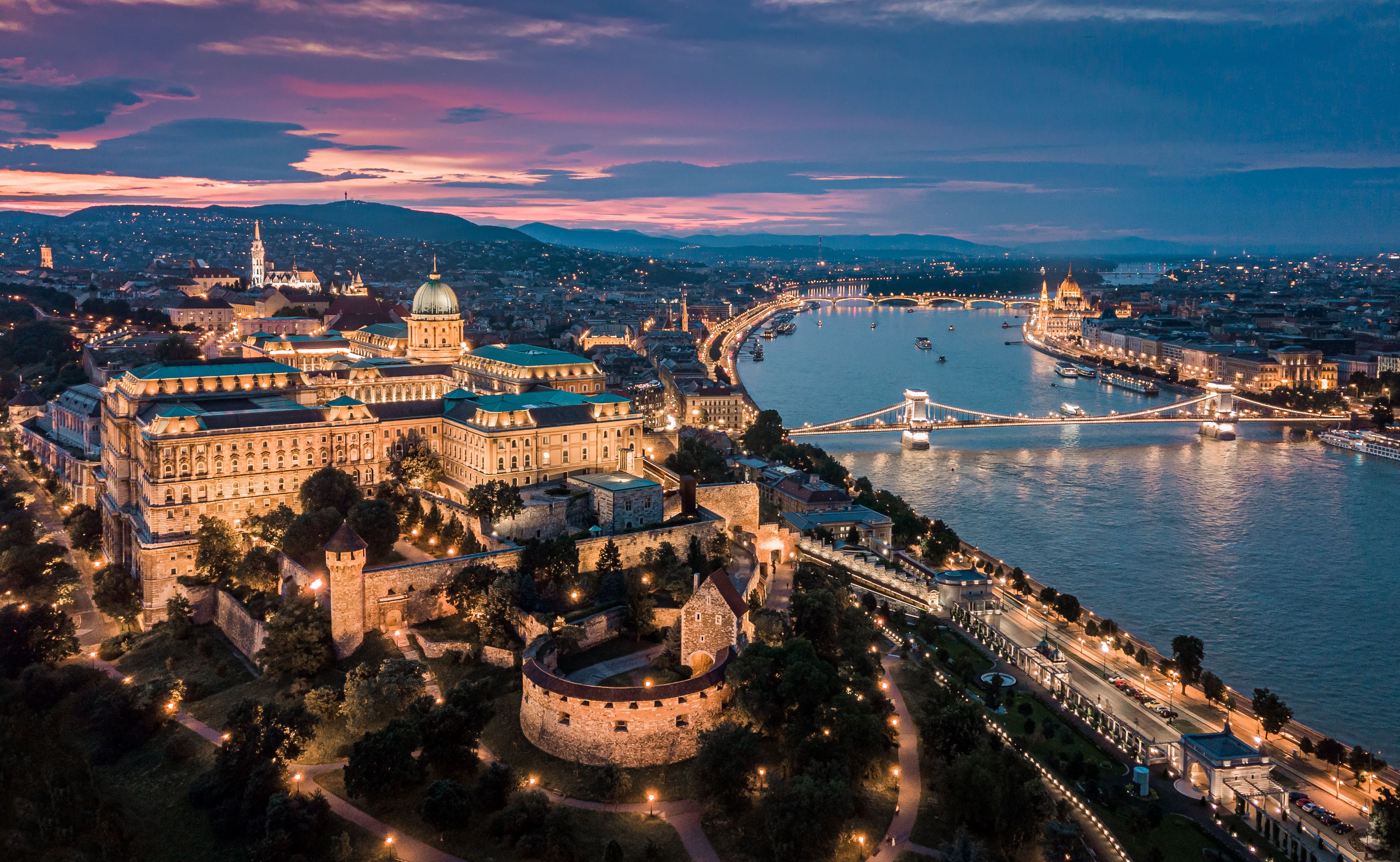 A panoramic view of Budapest city lit up after dark
