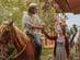 A view of people on horses about to go for a riding tour in Colombia