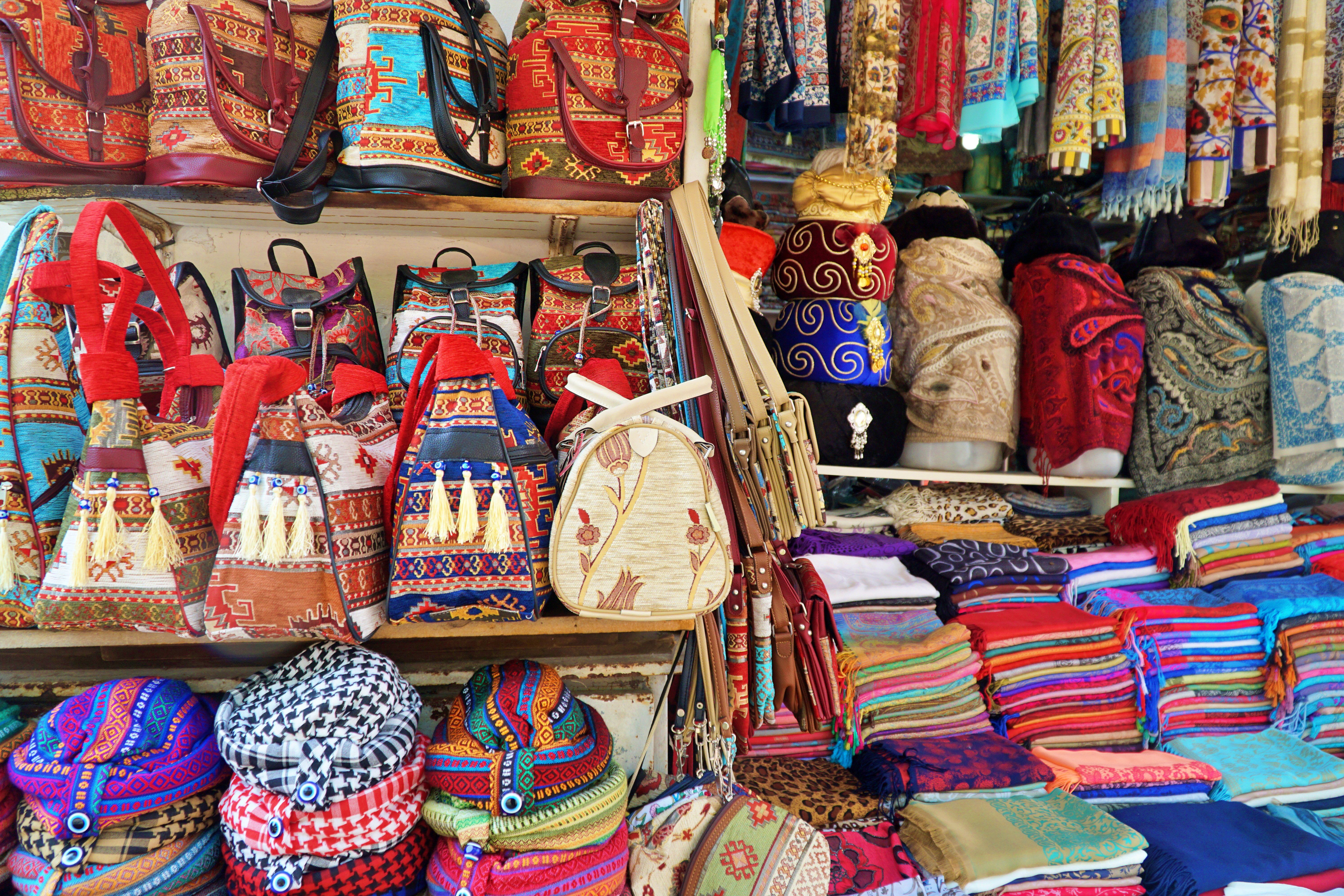 Colourful bags and traditional souvenirs at a market stall in Antalya, Turkey