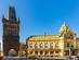 View of medieval Gothic Powder Tower (Powder Gate) and the Municipal House on Republic Square in Prague