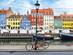 Nyhavn harbour in Copenhagen, Denmark on a bright, winter day with a street light and bicycles in front of the colourful houses