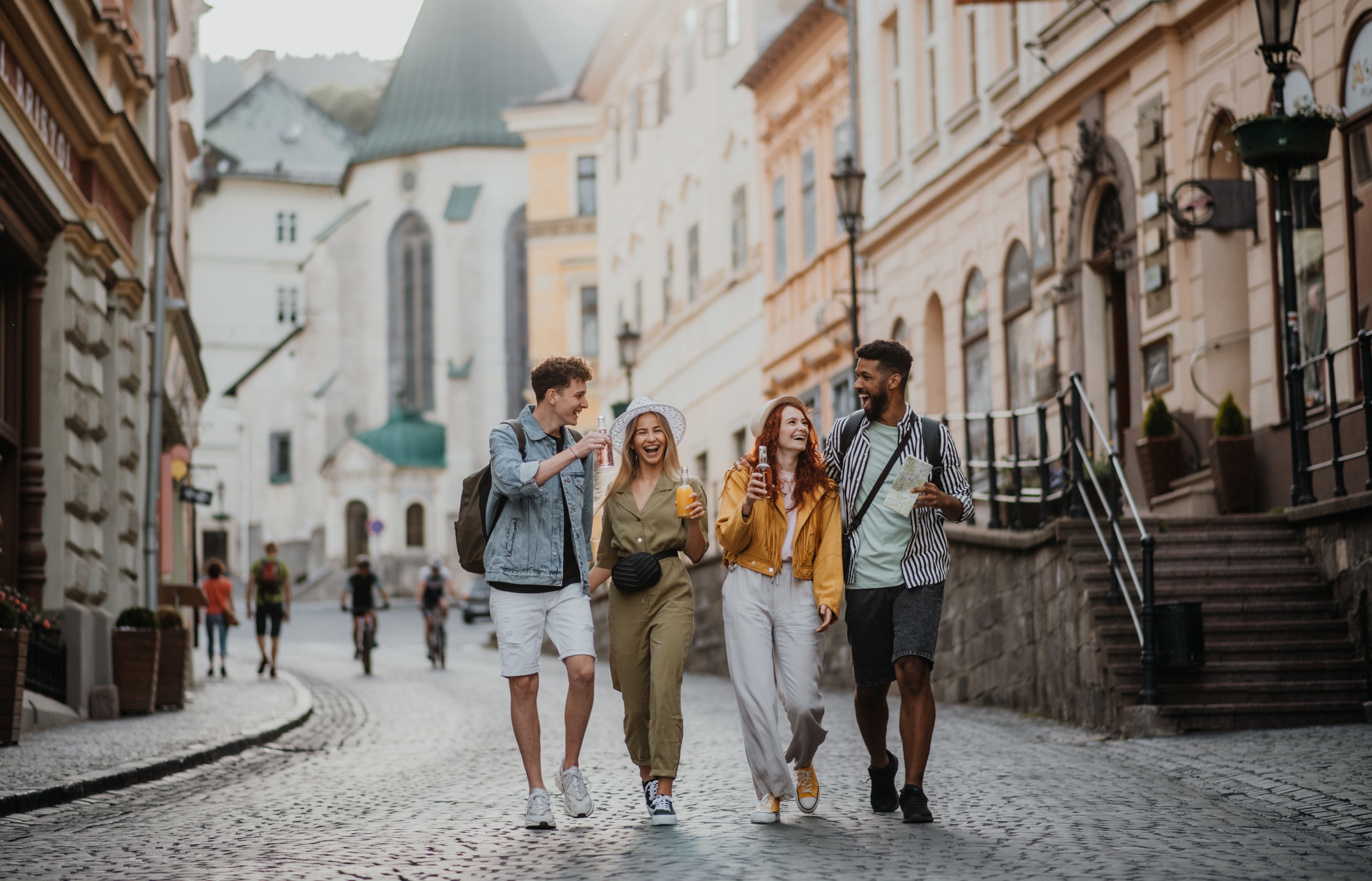 Group of friends walking down a street on a city break