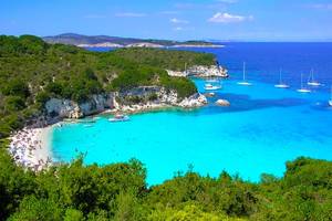 An image of turquoise waters and white sand in the beautiful Voutoumi beach on Antipaxos island, Greece