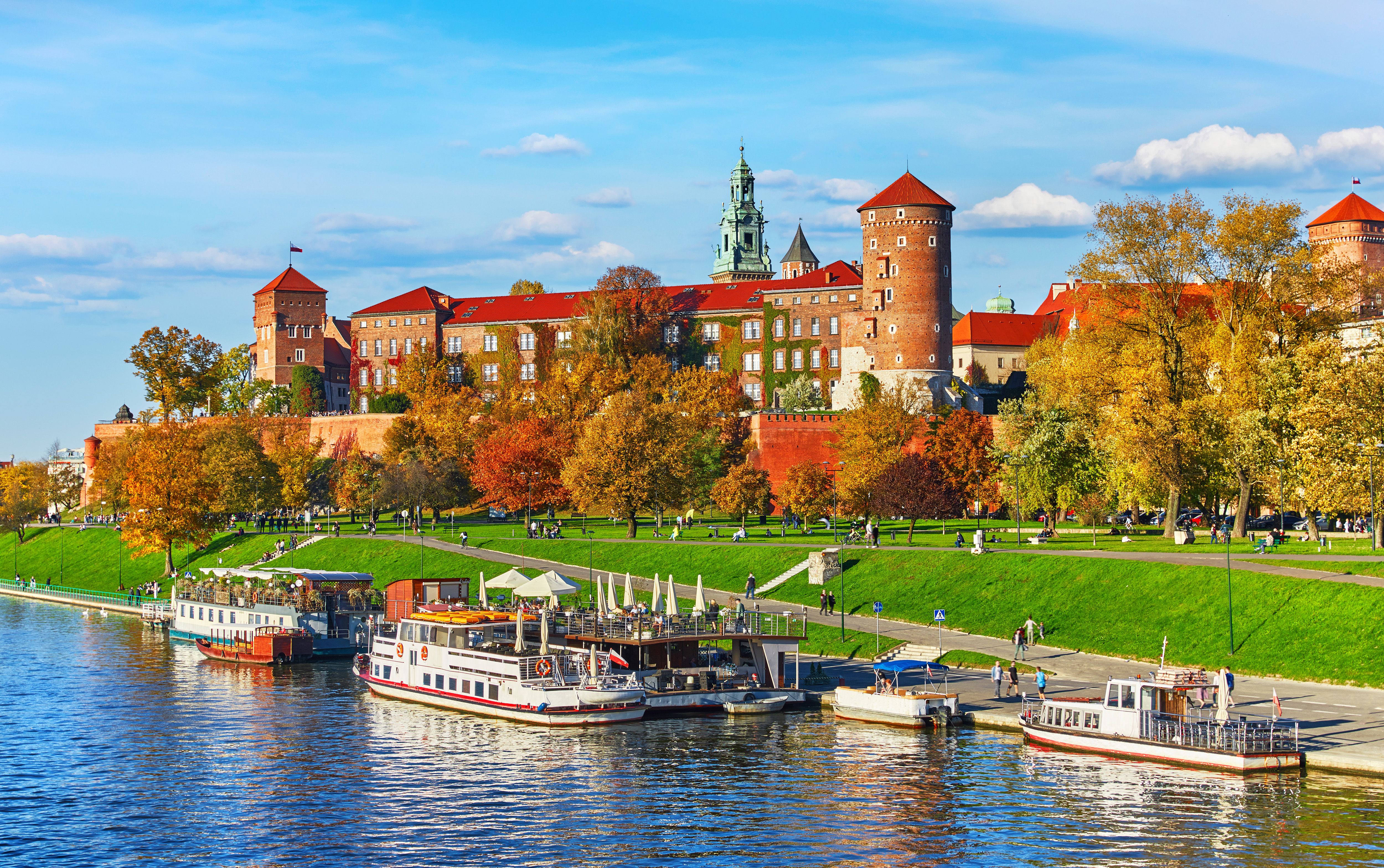 View across the River Wisla to the red brick Wawel Castle in Krakow on an autumn day