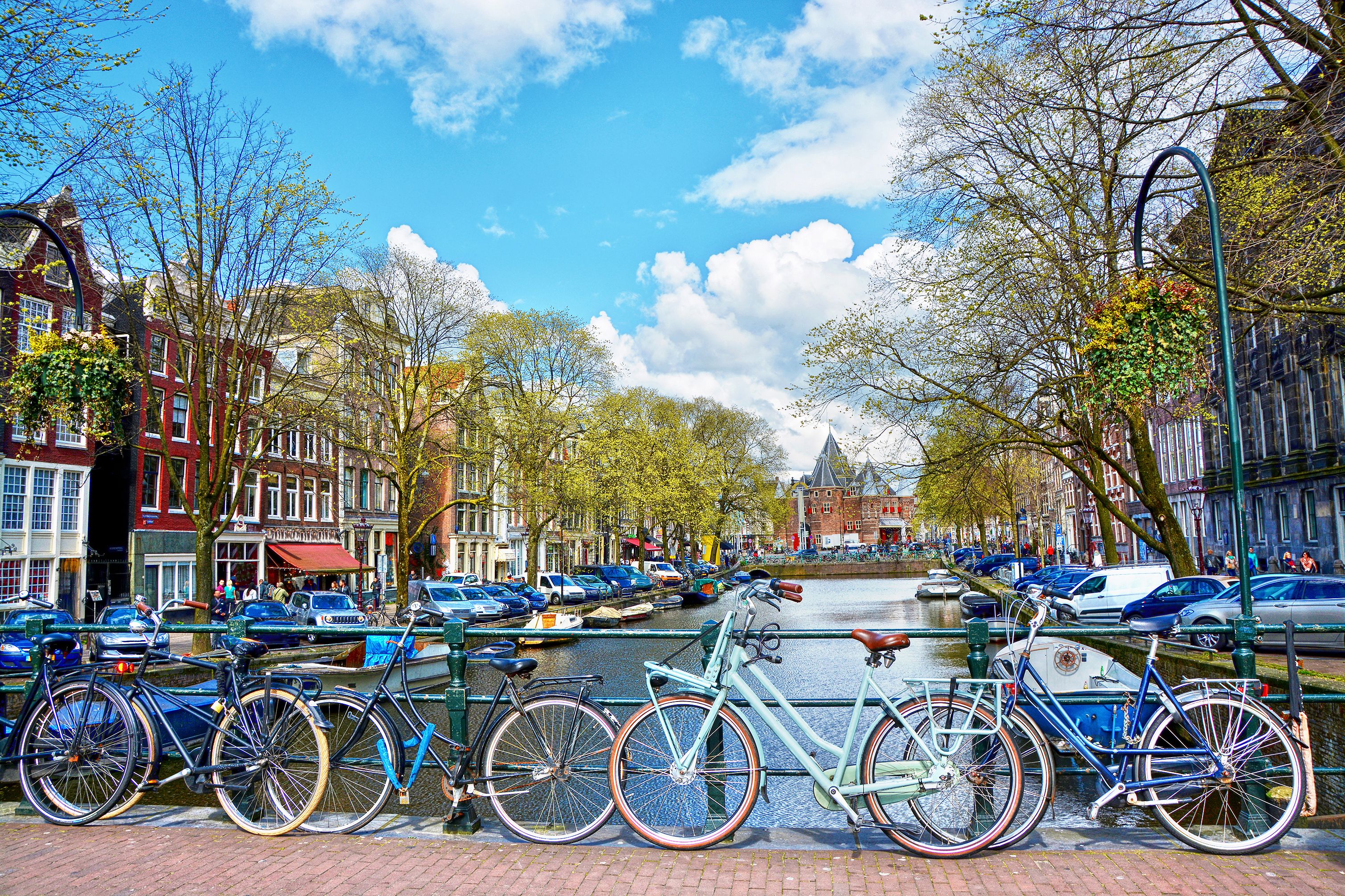 Bicycles parked on a canal bridge in Amsterdam