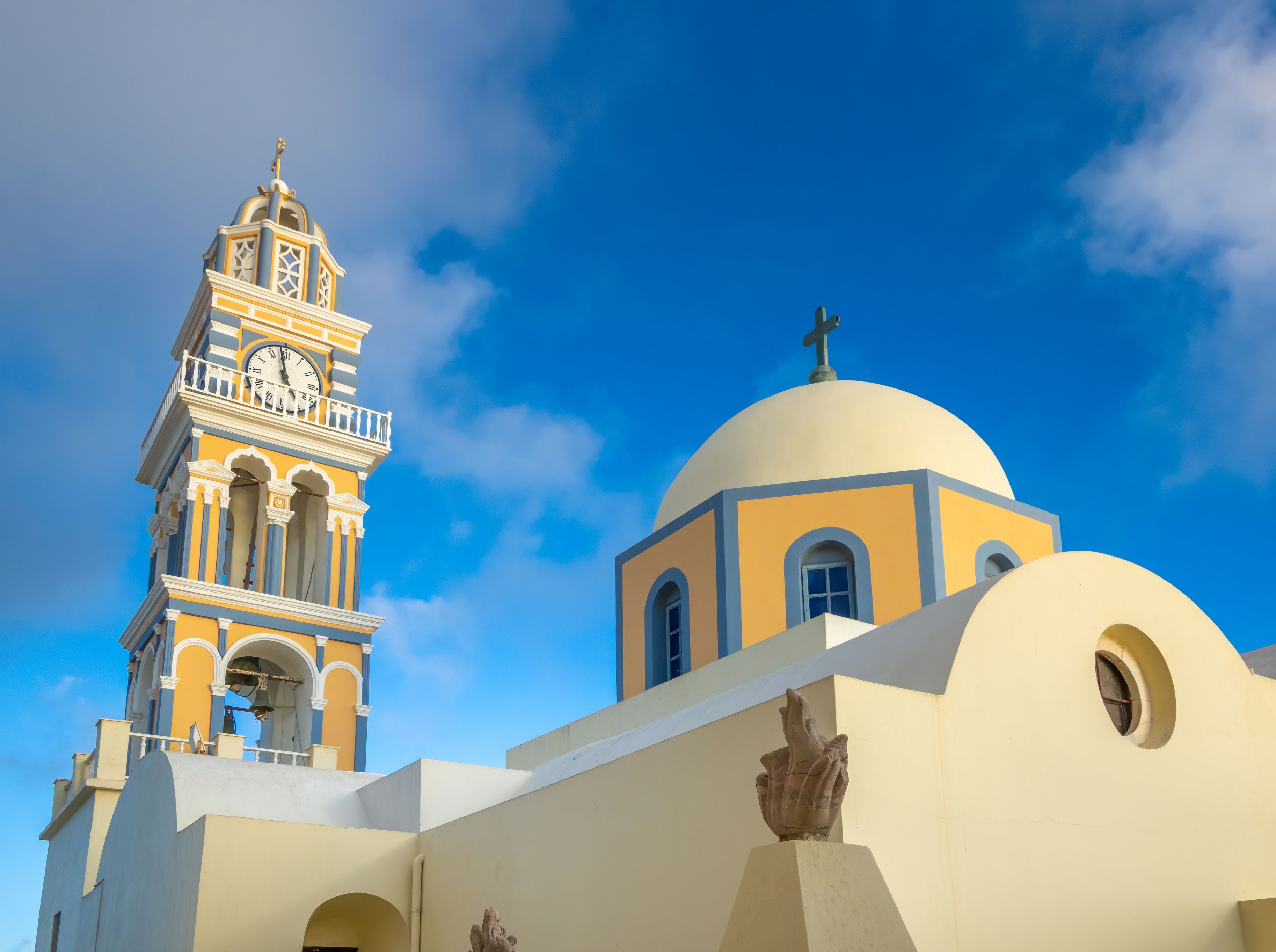 A close up image of Fira Cathedral in Santorini with its ornate bell tower