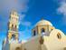 A close up image of Fira Cathedral in Santorini with its ornate bell tower