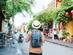 A solo man walking through a street in Hoi An, Vietnam